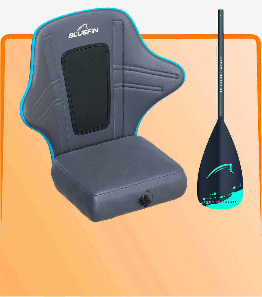 Gray padded seat with blue trim and back support next to a black paddle with teal accents