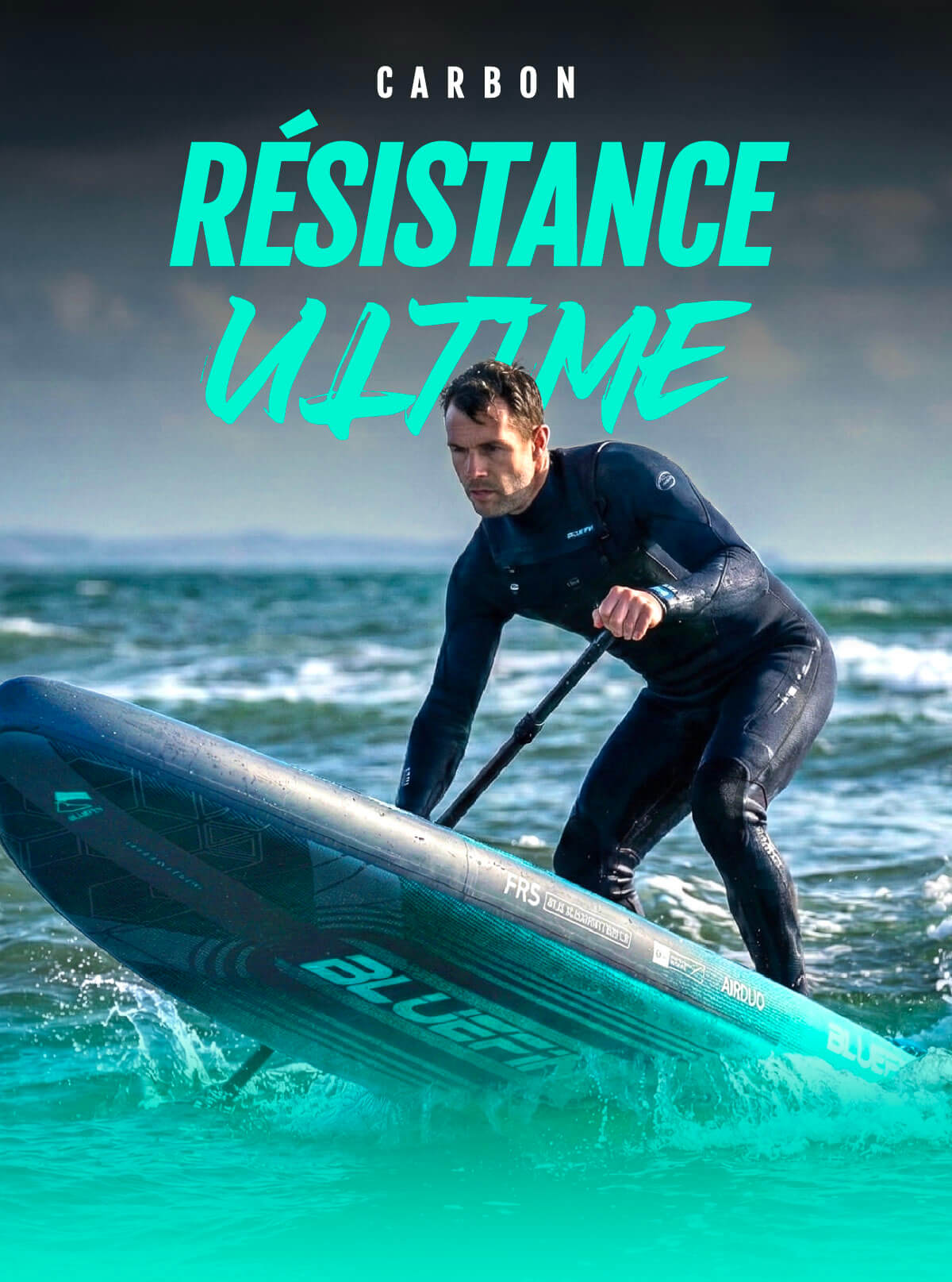Paddleboarder in a wetsuit paddling on water, using a blue inflatable board with a textured surface.
