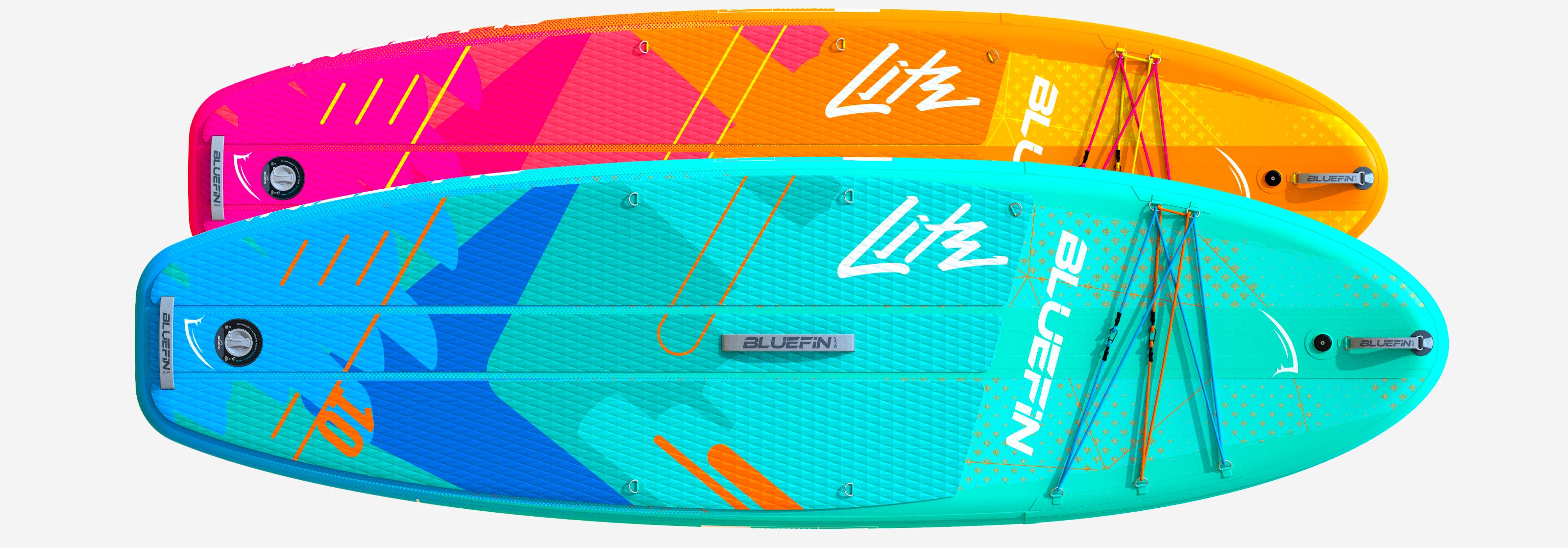 Two inflatable paddleboards in bright colors, one pink and blue, the other teal and orange, with textured decks.