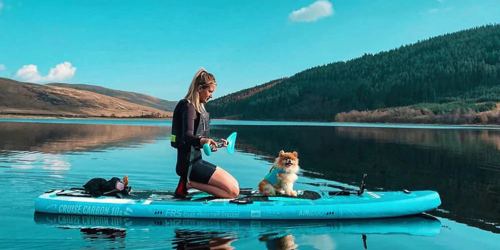 Paddle boarding with a dog