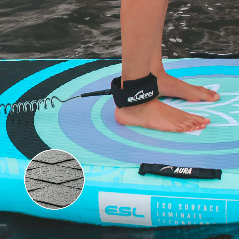 Inflatable paddleboard with textured surface, ankle leash, and close-up of deck pad pattern