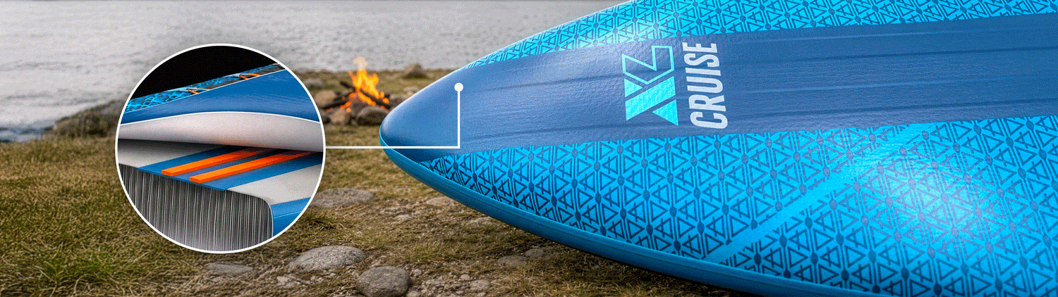 Inflatable paddleboard with textured blue surface, center fin, and visible inflation valve