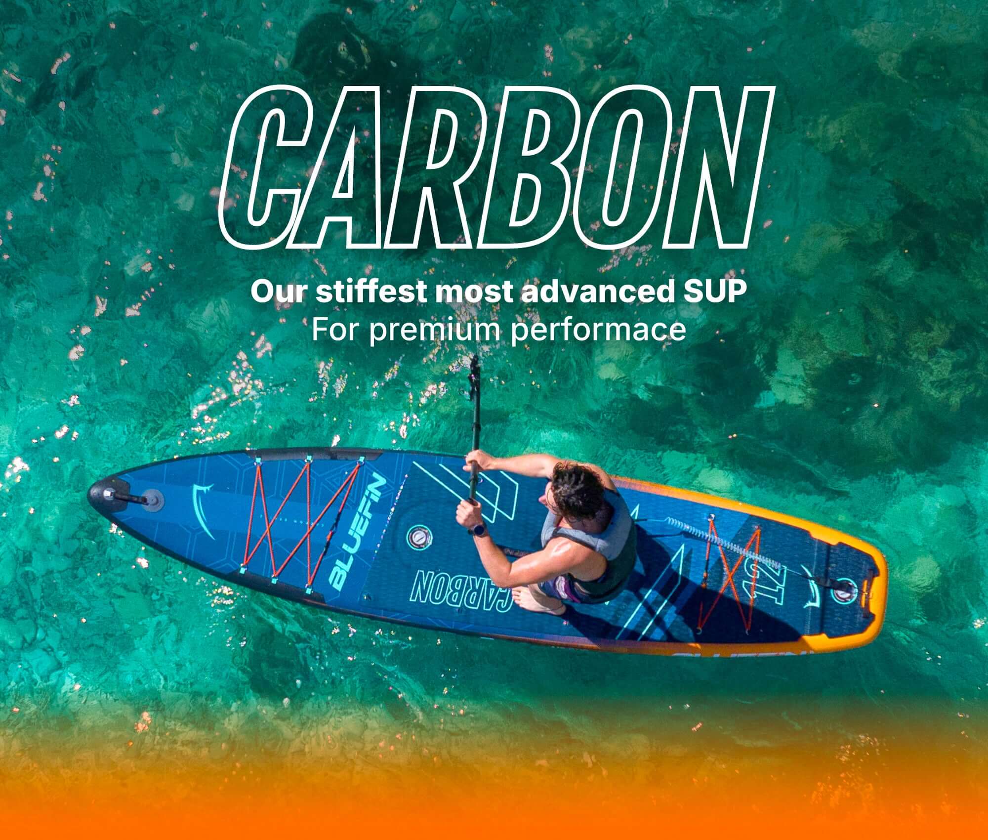 Inflatable paddleboard with blue design, paddler, and clear water background for water sports