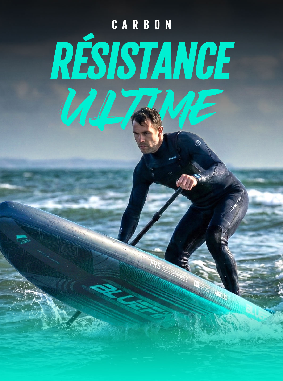 Paddleboarder in a wetsuit paddling on water, using a blue inflatable board with a textured surface.
