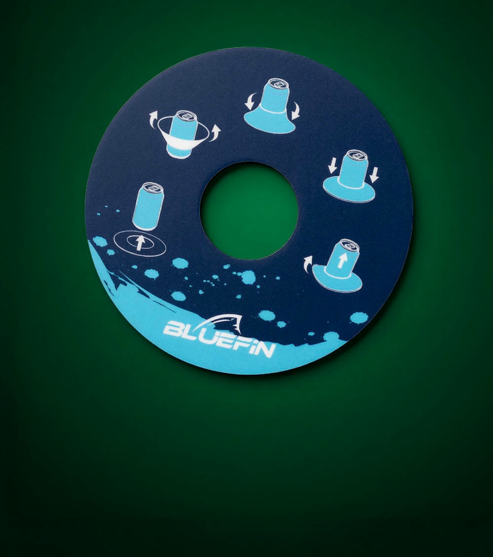 Round blue instruction disc with graphics for can placement and rotation, featuring Bluefin logo.