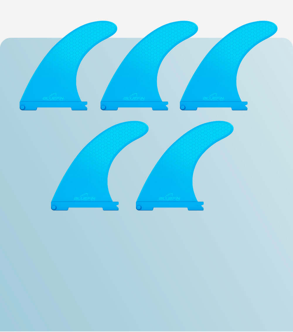 Five blue surfboard fins with a honeycomb pattern on a light background